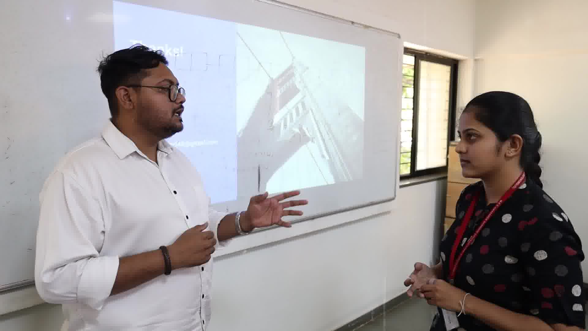 Students collaborating on laptops